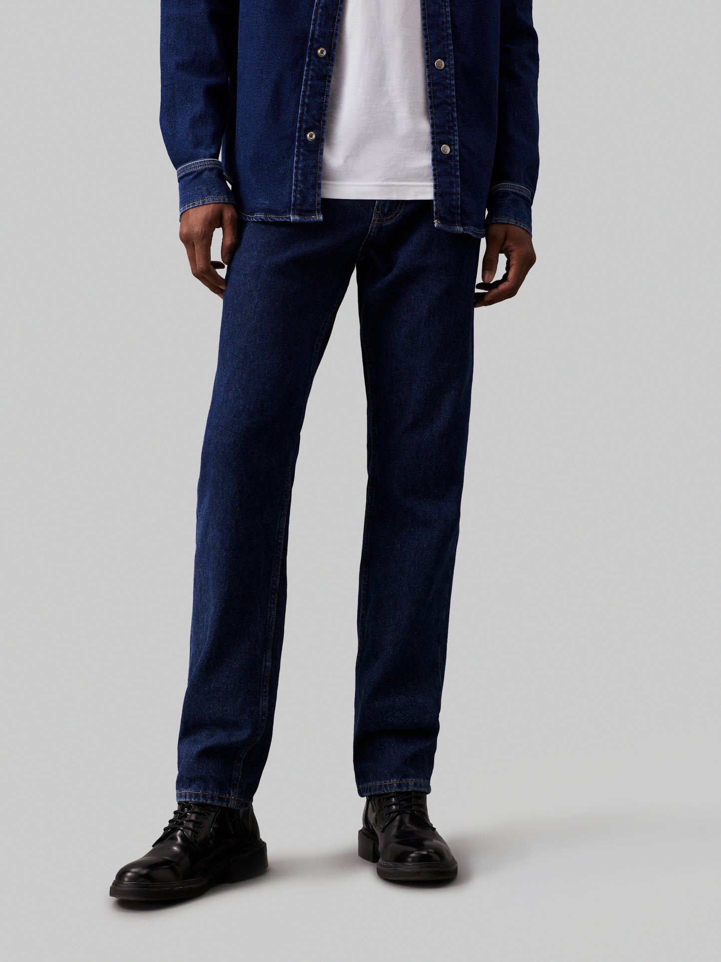 CK SLIM TAPPERED JEANS - DARK DENIM