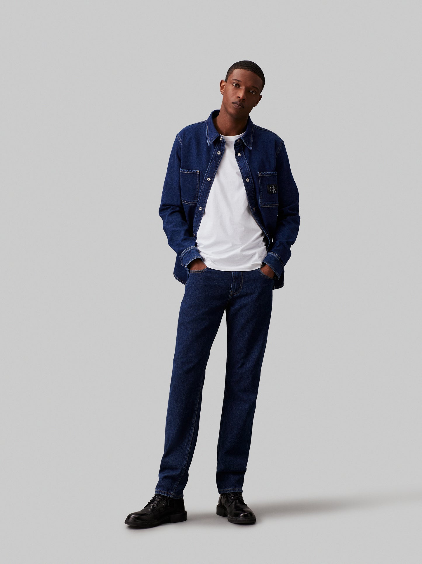 CK SLIM TAPPERED JEANS - DARK DENIM